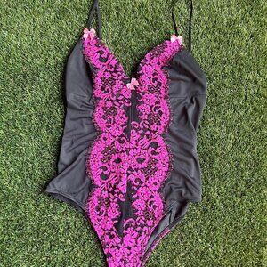 Black and pink lace bodysuit with a cute bow detail